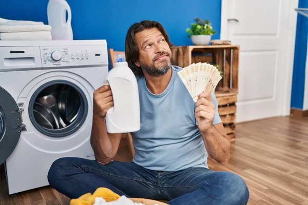 Handsome Middle Age Man Saving Money Laundry Detergent Smiling Looking — Stockfoto