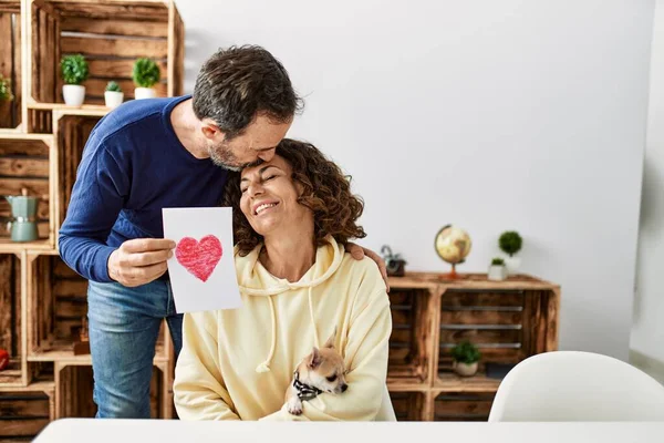 Middle Age Hispanic Couple Kissing Holding Paper Heart Draw Home — Photo