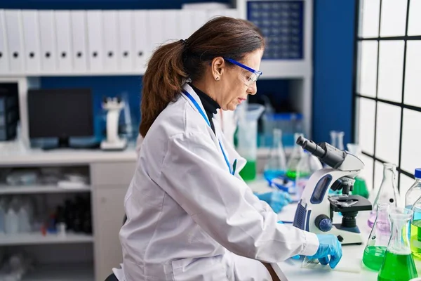 Middle Age Man Woman Scientists Using Microscope Working Laboratory — Fotografia de Stock