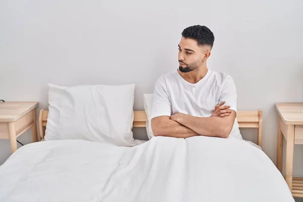 Young Arab Man Sitting Bed Angry Expression Arms Crossed Gesture — Foto Stock