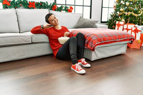 Young Hispanic Woman Watching Movie Sitting Christmas Tree Home — Fotografia de Stock