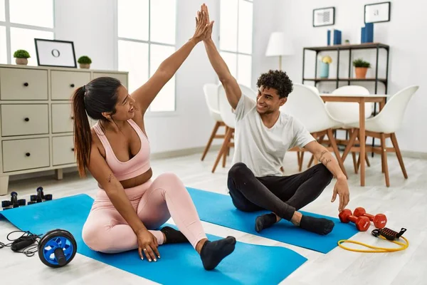 Young Latin Couple Smiling Happy Training Home Sitting Floor High — ストック写真