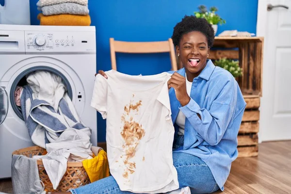 African American Woman Holding Shirt Dirty Stain Sticking Tongue Out — Stock Photo, Image