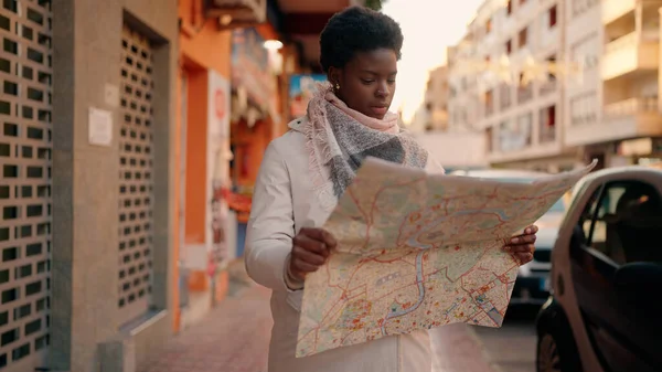 Young African American Woman Serious Expression Holding City Map Street — ストック写真