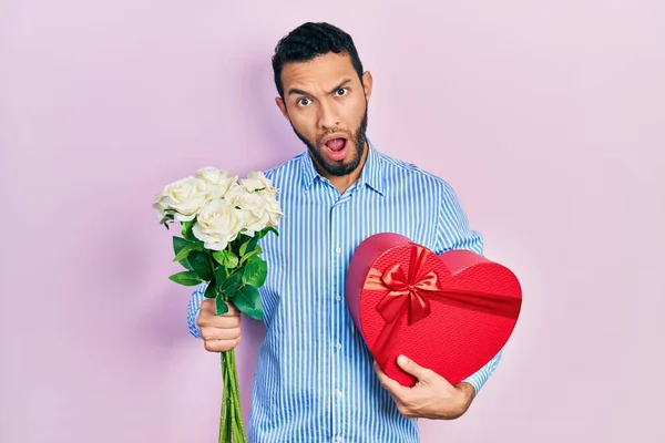 Hispanic Man Beard Holding Anniversary Present Bouquet Flowers Shock Face — Zdjęcie stockowe
