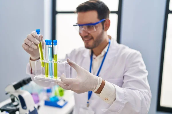 Young Hispanic Man Scientist Holding Test Tubes Laboratory — 스톡 사진