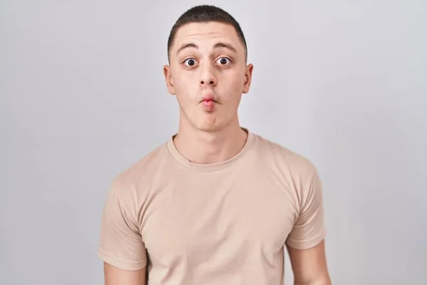 Young Man Standing Isolated Background Making Fish Face Lips Crazy — Fotografia de Stock