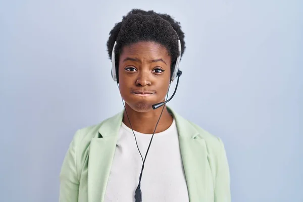 African American Woman Wearing Call Center Agent Headset Puffing Cheeks — Stockfoto