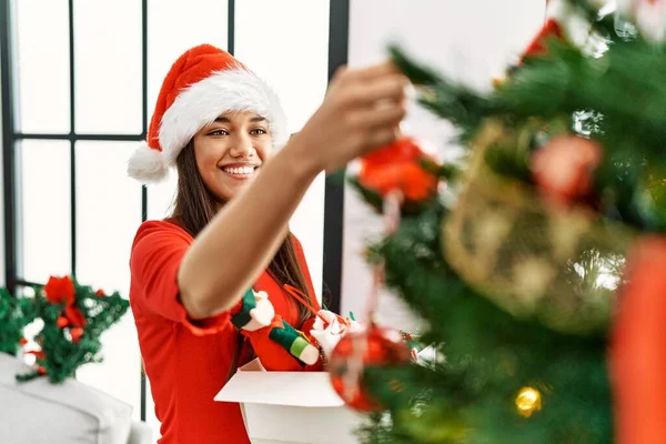 Young Latin Woman Open Gift Bag Sitting Christmas Decor Home — Φωτογραφία Αρχείου