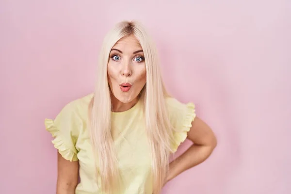 Caucasian Woman Standing Pink Background Shock Face Looking Skeptical Sarcastic — Fotografia de Stock