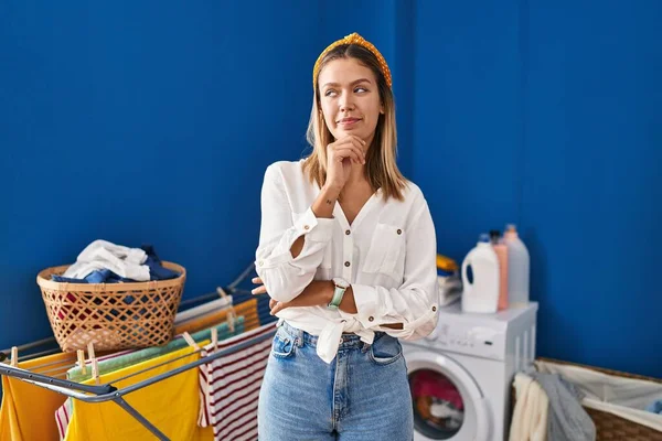 Young Blonde Woman Laundry Room Looking Confident Camera Smiling Crossed — Stockfoto