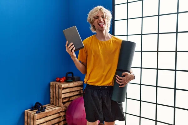 Young Man Holding Yoga Room Sticking Tongue Out Happy Funny — ストック写真