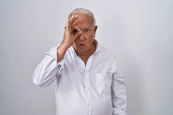 Senior Man Grey Hair Standing Isolated Background Doing Gesture Shocked — Stockfoto
