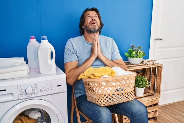 Handsome Middle Age Man Waiting Laundry Begging Praying Hands Together — Stockfoto