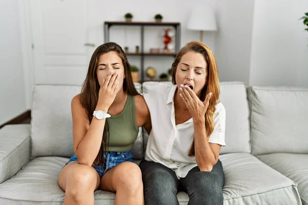 Mother Daughter Together Sitting Sofa Home Bored Yawning Tired Covering — Foto Stock