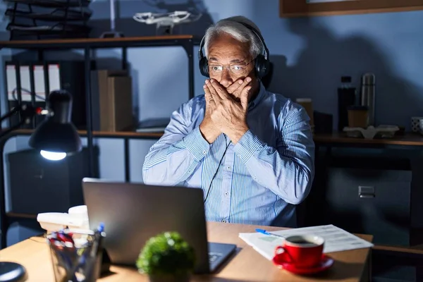 Hispanic Senior Man Wearing Call Center Agent Headset Night Shocked — ストック写真