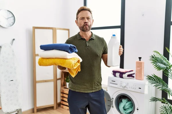 Middle Age Man Holding Clean Laundry Detergent Bottle Making Fish — Foto de Stock