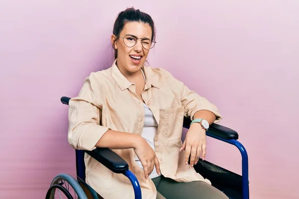 Young Hispanic Woman Sitting Wheelchair Winking Looking Camera Sexy Expression — ストック写真