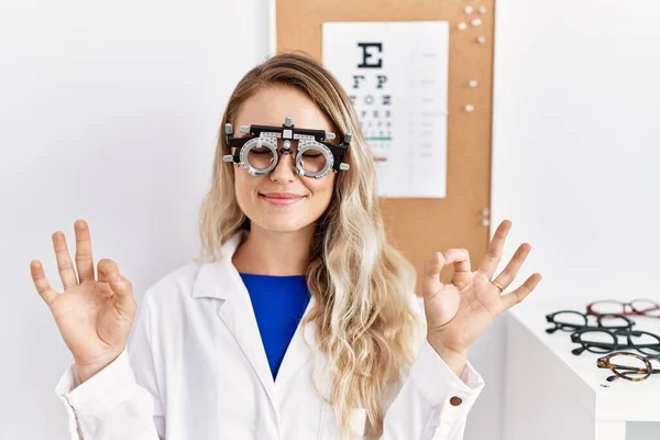 Young Beautiful Optician Woman Wearing Optometry Glasses Clinic Relax Smiling — Stockfoto