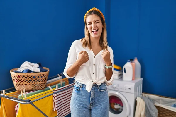 Young Blonde Woman Laundry Room Very Happy Excited Doing Winner — Stockfoto