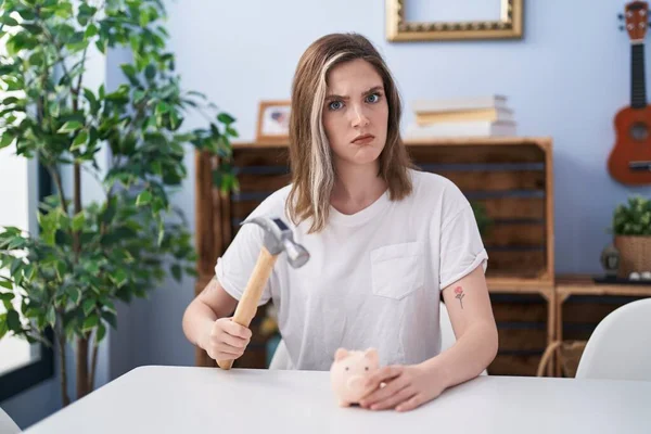 Blonde Caucasian Woman Holding Piggy Bank Hammer Skeptic Nervous Frowning — Photo