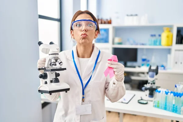 Young Brunette Woman Working Scientist Laboratory Holding Pink Ribbon Looking — Photo