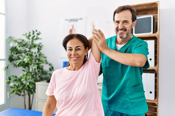 Middle Age Man Woman Smiling Confident Stretching Arm Having Rehab — Stock Photo, Image