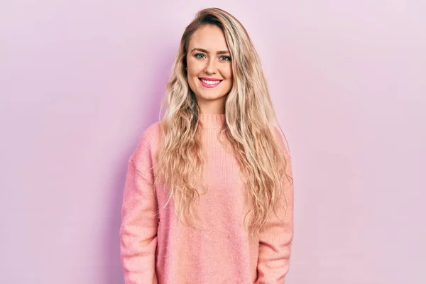 Beautiful Young Blonde Woman Wearing Pink Sweater Looking Positive Happy — 스톡 사진