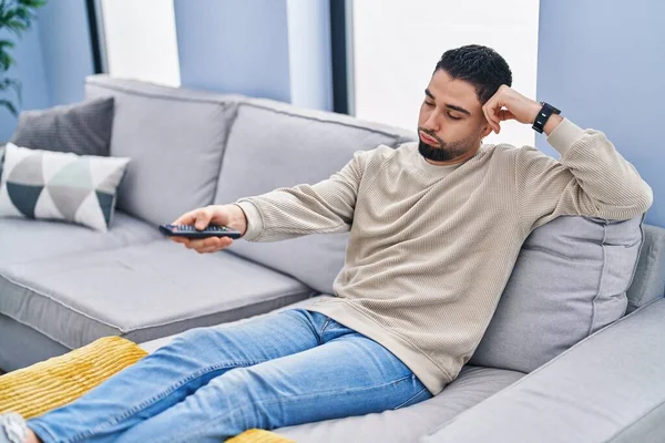 Young Arab Man Watching Boring Expression Home — Stockfoto