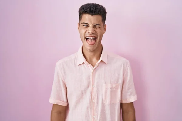 Young Hispanic Man Standing Pink Background Sticking Tongue Out Happy — Stockfoto