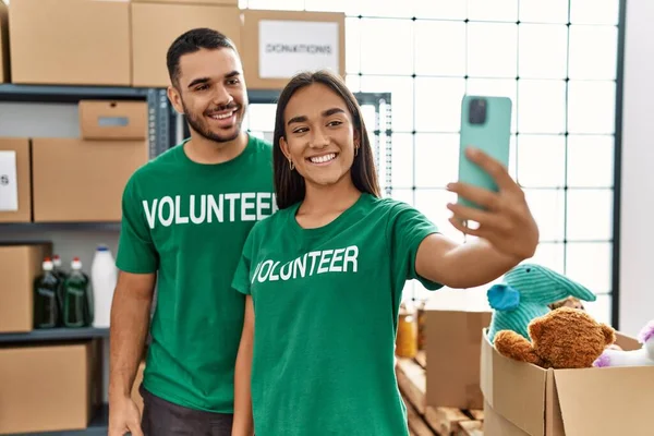 Young Latin Volunteer Couple Smiling Happy Making Selfie Smartphone Charity — Stock Photo, Image