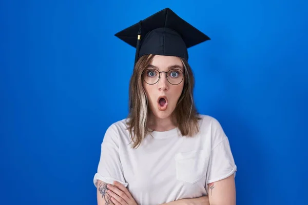 Blonde Caucasian Woman Wearing Graduation Cap Afraid Shocked Surprise Expression — Stockfoto