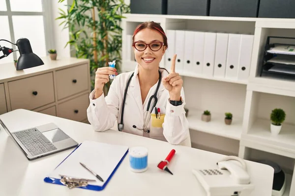Young Caucasian Woman Wearing Doctor Uniform Holding Cotton Buds Smiling — Fotografia de Stock