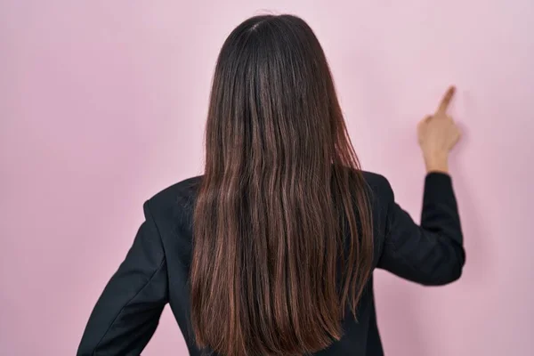 Young Brunette Woman Wearing Business Style Pink Background Posing Backwards — Stok fotoğraf