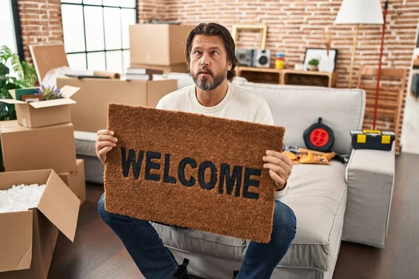 Handsome Middle Age Man Holding Welcome Doormat New Home Making — Fotografia de Stock