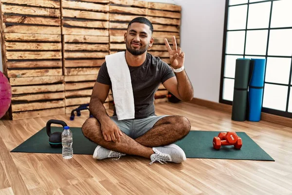 Young Indian Man Sitting Training Mat Gym Smiling Looking Camera — Stok fotoğraf