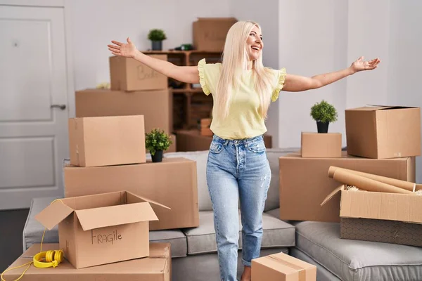 Young Blonde Woman Standing Open Arms New Home — Stock Photo, Image