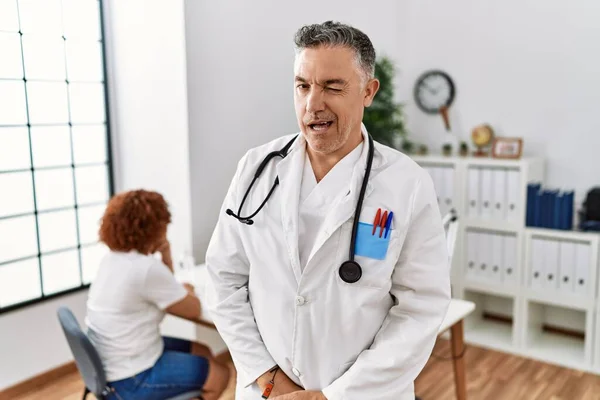 Middle Age Doctor Man Clinic Patient Winking Looking Camera Sexy — Foto Stock