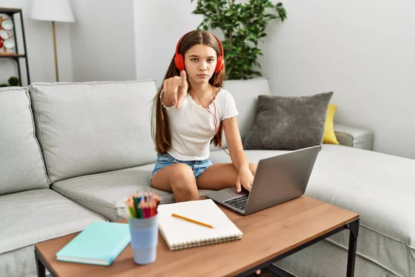 Young Brunette Teenager Doing Homework Laptop Home Pointing Finger Camera — Stok fotoğraf