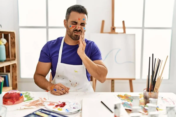 Young Hispanic Man Beard Art Studio Painted Face Touching Mouth — 图库照片