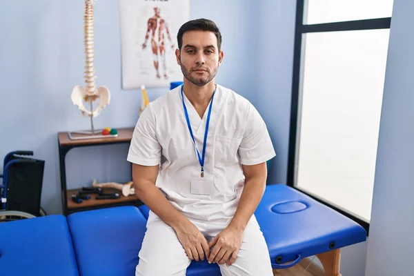 Young Hispanic Man Beard Working Pain Recovery Clinic Relaxed Serious — Foto de Stock