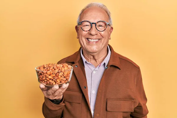 Senior Man Grey Hair Holding Fried Peanuts Looking Positive Happy — Fotografia de Stock