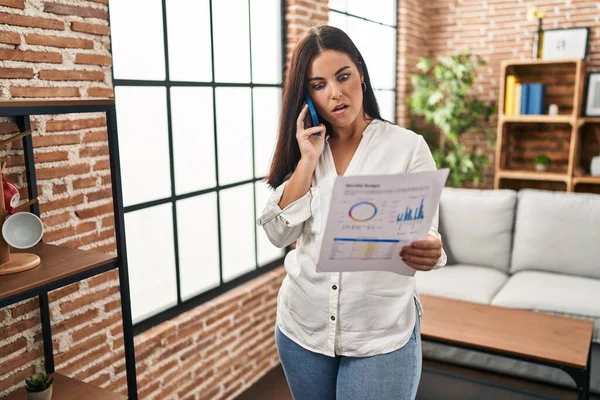 Young Hispanic Woman Speaking Phone Bills Shock Face Looking Skeptical — Stock Photo, Image