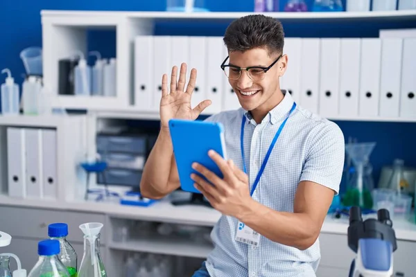 Young Hispanic Man Working Scientist Laboratory Doing Video Call Looking — Photo