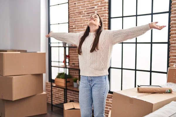 Young Woman Standing Arms Open New Home — Stockfoto