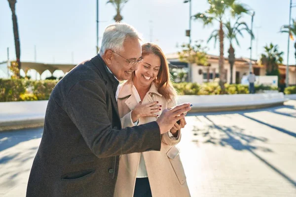 Middle Age Man Woman Couple Smiling Confident Using Smartphone Park — Stockfoto