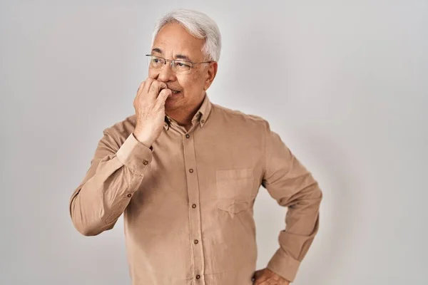 Hispanic Senior Man Wearing Glasses Looking Stressed Nervous Hands Mouth — Stockfoto