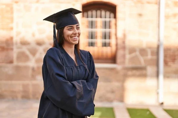 Young Hispanic Woman Wearing Graduated Uniform Standing Arms Crossed Gesture — ストック写真