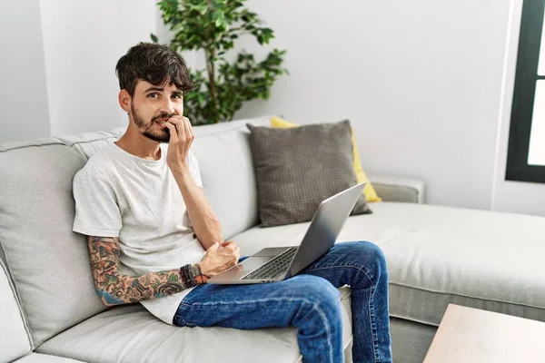 Hispanic Man Beard Sitting Sofa Looking Stressed Nervous Hands Mouth — Fotografia de Stock