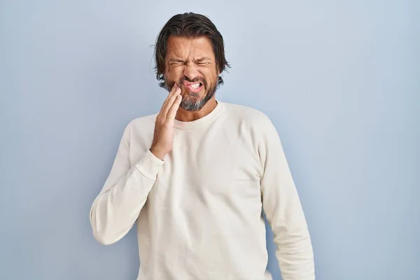 Handsome Middle Age Man Wearing Casual Sweater Blue Background Touching — ストック写真